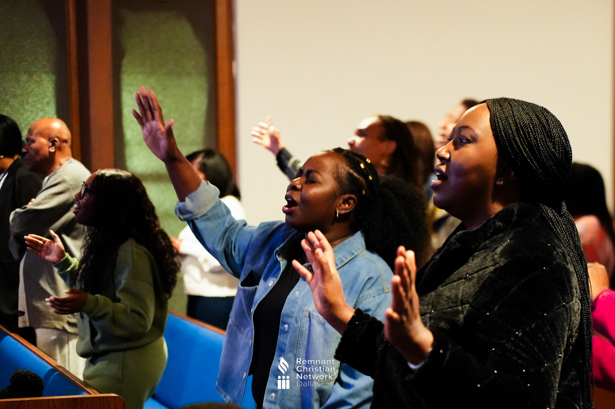 Church community worshiping together in a sanctuary